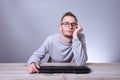 Funny nerd young businessman, man working on computer.Typing on the keyboard programmer in glasses in front of computer Royalty Free Stock Photo