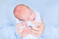 Funny newborn baby sleeping in his father's hands Royalty Free Stock Photo