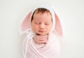 Funny newborn in knitted hat