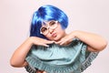 Funny nine years old girl with a wig and kissy face Royalty Free Stock Photo