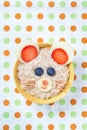 Funny oat porridge with mouse face made of fruits and berries, food for kids idea, top view Royalty Free Stock Photo