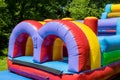 Funny off kids in the inflatable slides Royalty Free Stock Photo