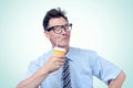 Funny office man drinking from a paper cup with a straw. Eyes closed of pleasure