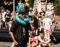 Funny old man with inflatable beach toys