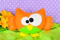 Funny orange owl toy. Children felt crafts