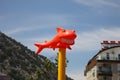 Funny orange shark with snow-white smile in the sun against the sky Royalty Free Stock Photo