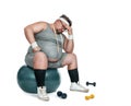 Funny overweight depressed sports ned sitting on the fitness ball