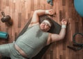Funny overweight exhausted sportsman