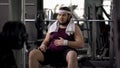 Funny overweight male stroking belly, exhausted after workout, insecurities