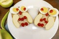 Funny owl face sandwich toast bread with chicken eggs, apple, banana, dried berry fruits on plate. Cute kids Royalty Free Stock Photo