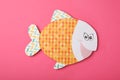 Funny paper fish on pink background. April Fool`s Day Royalty Free Stock Photo