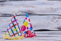 Funny party cone hats on wooden boads.