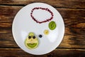 funny pear face on a plate thinking Royalty Free Stock Photo