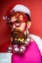 Funny people christmas. Santa claus - bearded hipster. Bearded Santa Claus - close up portrait.