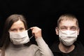 And funny people, a man and a woman in protective medical antimicrobial and anti- bacterial masks from coronavius covid