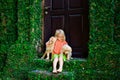 Funny photo of child cuddling beautiful golden labrador retriever puppy Royalty Free Stock Photo