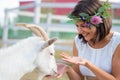 Funny picture a beautiful young girl farmer with a wreath on her Royalty Free Stock Photo