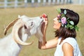 Funny picture a beautiful young girl farmer with a wreath on her Royalty Free Stock Photo