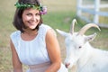 Funny picture a beautiful young girl farmer with a wreath on her Royalty Free Stock Photo