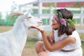 Funny picture a beautiful young girl farmer with a wreath on her Royalty Free Stock Photo