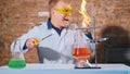 A scientist conducts an experiment and his hand lights up Royalty Free Stock Photo