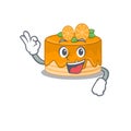 A funny picture of orange cake making an Okay gesture