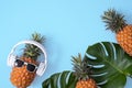 Funny pineapple wearing white headphone isolated on blue background Royalty Free Stock Photo