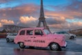 Funny pink car Marc Jacobs parked in Paris with Eiffel tower in the background. Royalty Free Stock Photo
