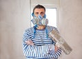 Funny plastering man mason with protective mask and trowel Royalty Free Stock Photo