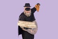 Funny plump man in hero suit holds boxes and pizza slice on purple background