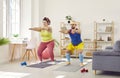 Funny plump woman doing squats with her personal trainer Royalty Free Stock Photo