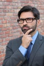 A funny pondering businessman with glasses Royalty Free Stock Photo