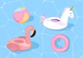 Funny pool floats with flamingo and unicorn. Vector illustration. Pool toys on blue sea background.