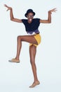 Funny, portrait and black woman with fashion, goofy and cheerful girl on white studio background. African person