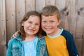 Funny portrait of boy and girl smiling with gaps in teeth. Children have fun showing milk theath. Close up of pre-teen Royalty Free Stock Photo