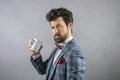 Funny portrait of business man in suit with red bow tie a coffee cup funny face Royalty Free Stock Photo