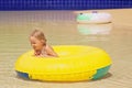 Funny portrait of cheerful baby girl swimming in water park Royalty Free Stock Photo