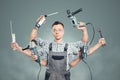 Funny portrait of a craftsman with 6 arms and tools Royalty Free Stock Photo