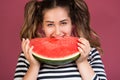 Funny portrait happy smiling young woman eating a slice of watermelon Royalty Free Stock Photo