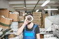 Funny portrait of a worker at the printing manufacturing