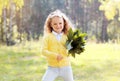 Funny positive little girl outdoors