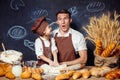 Playful man with daughter making bread