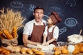 Playful man with daughter making bread