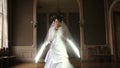 Funny pretty bride playing jedi with lightsaber