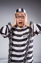 Funny prisoner in chains isolated on gray Royalty Free Stock Photo