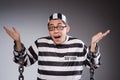 Funny prisoner in chains isolated on gray Royalty Free Stock Photo