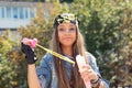 Funny puzzled teenager having fun with soap bubbles