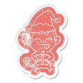 funny quirky cartoon distressed sticker of a monkey with christmas present wearing santa hat