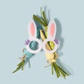 Funny rabbit ears decoration with ornament carrots behind. Royalty Free Stock Photo