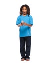 Funny rasta kid playing with cellphone in studio Royalty Free Stock Photo